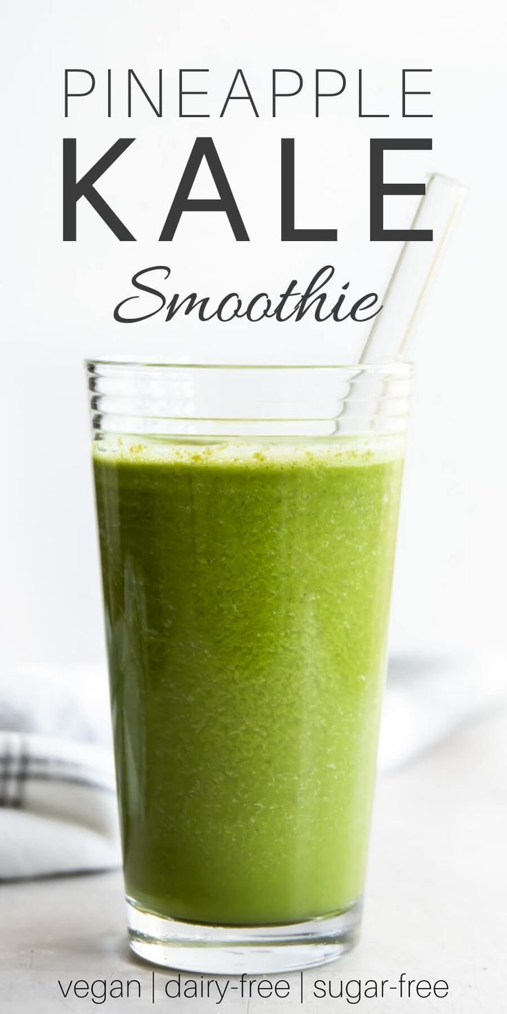 pineapple kale smoothie in a glass with a straw on the side and text overlay that reads, pineapple kale smoothie