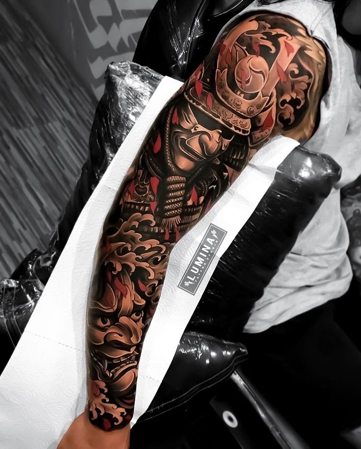 a man with a tattoo on his arm