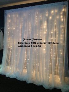 a white curtain with some lights on it