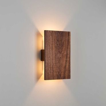 a wooden light fixture mounted to the side of a wall in a white walled room