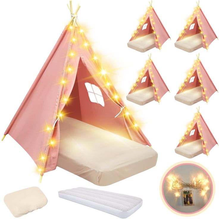 a pink teepee tent with lights on it and four mattresses in front of it