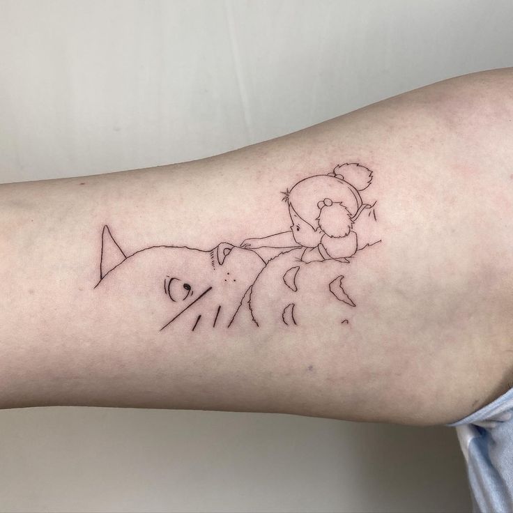 a person with a small tattoo on their arm