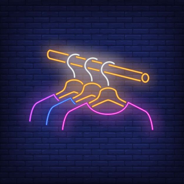 a neon sign that is hanging on a brick wall with some lights in the background