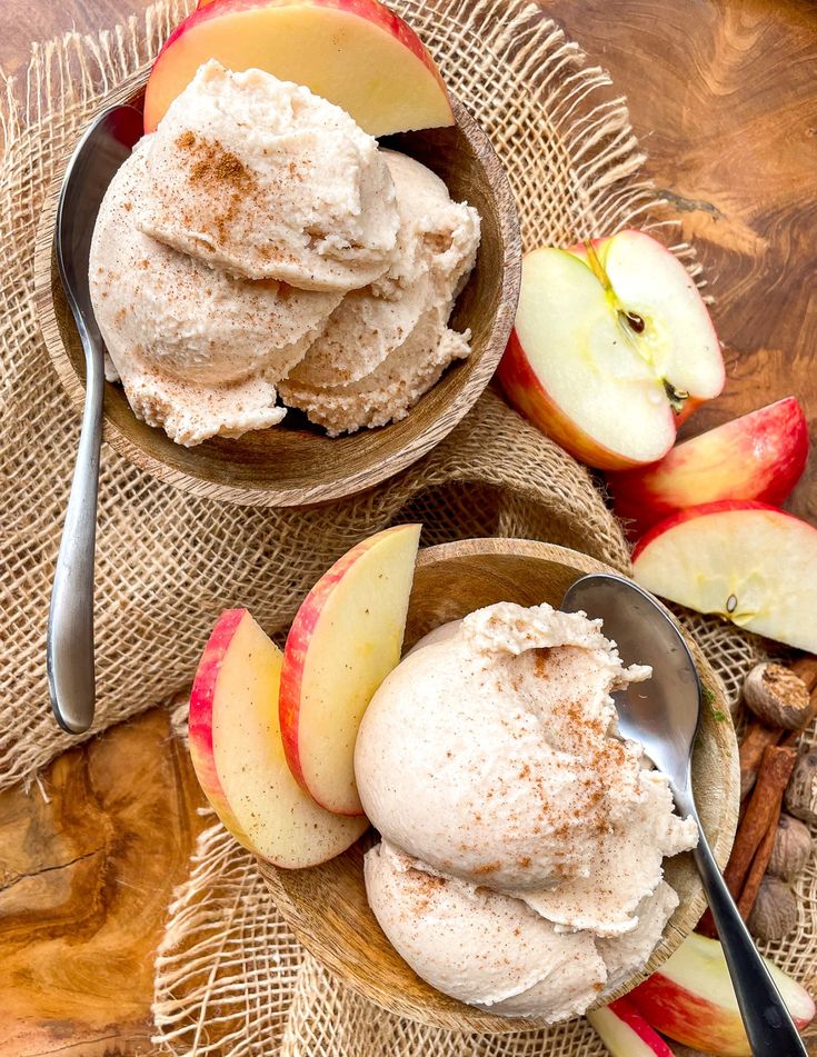 two bowls filled with ice cream and apples