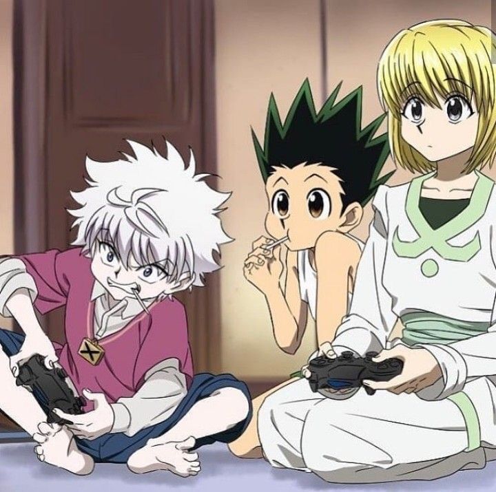 three anime characters are sitting on the floor