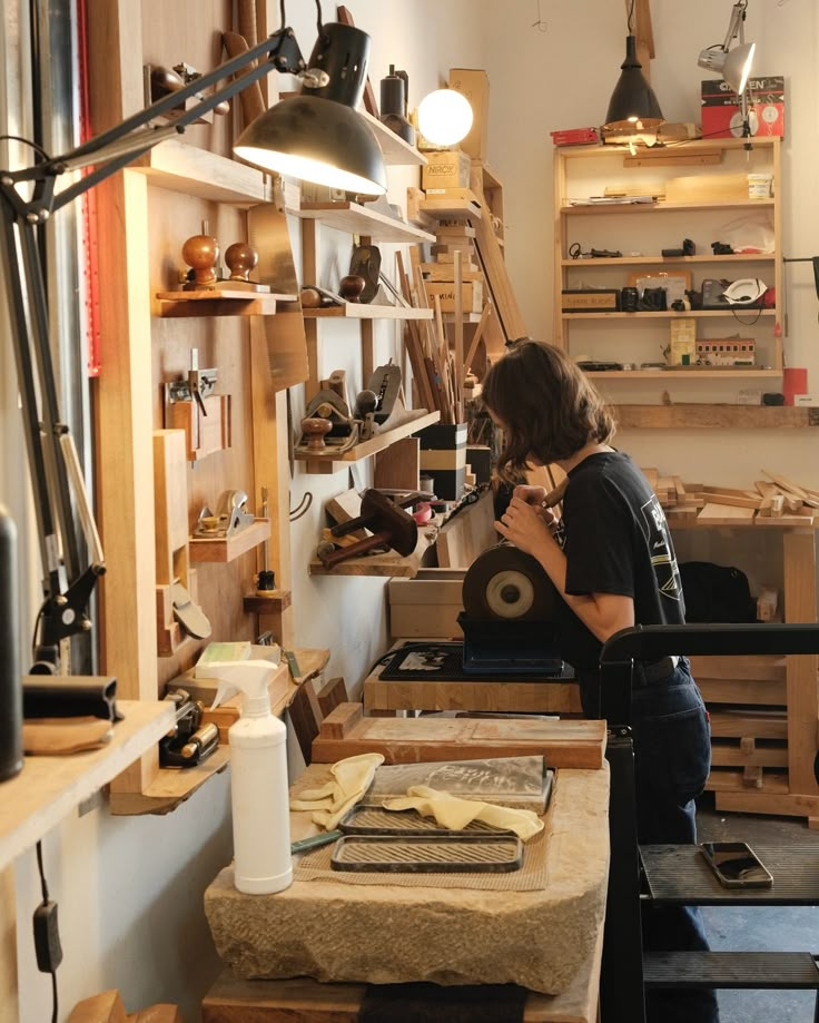 a woman is working in a shoe shop