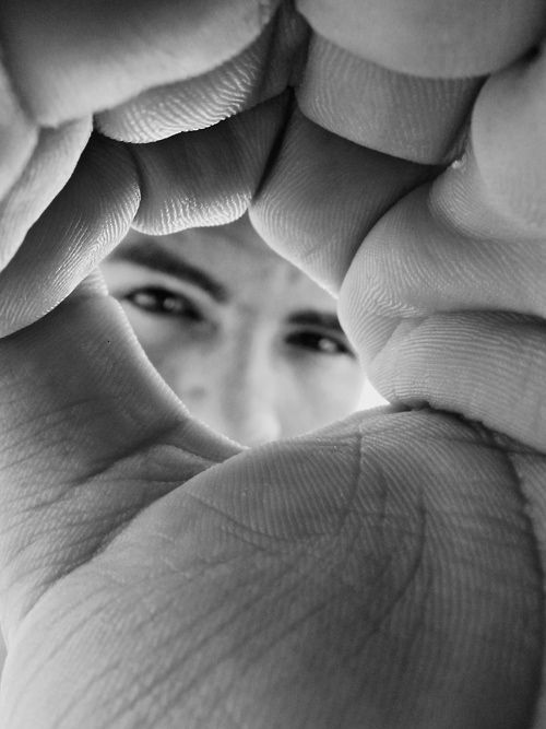 a woman's face with arabic writing in the middle and an image of her eyes