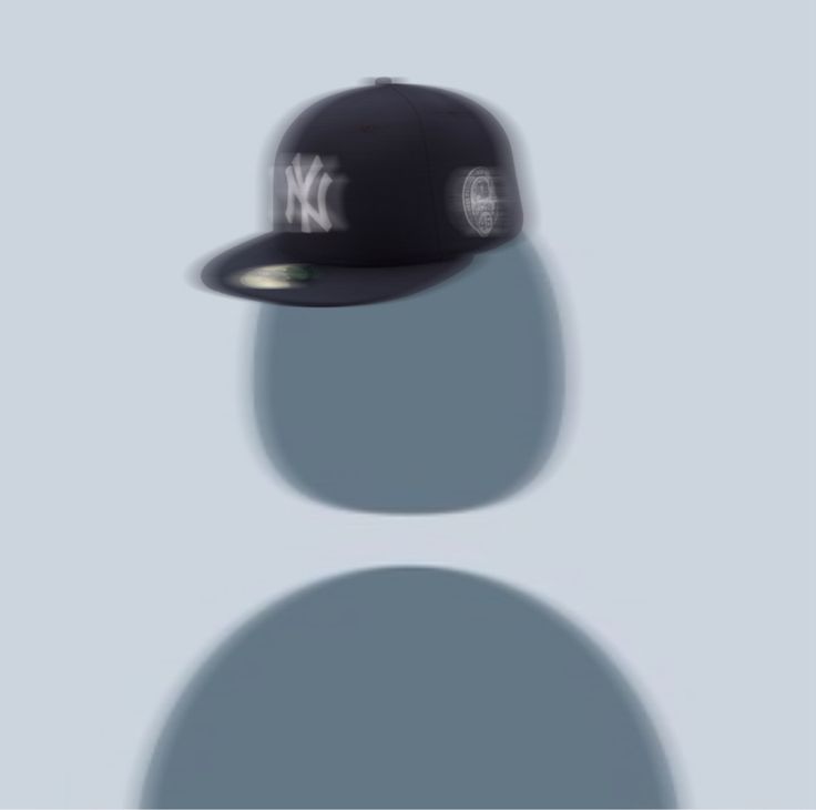 a new york yankees cap casts a shadow on a gray background in this image, it appears to be casting a shadow