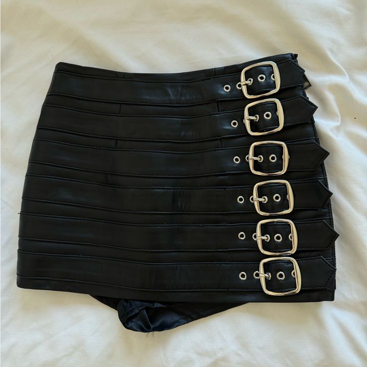 Leather Black Mini Skirt. Never Wear. Skirt With Short High Waist Bottoms With Belt Detail For Night Out, Edgy Party Skirt With Belt, High-waist Skirt With Belt For Night Out, High Waist Skirt With Belt For Night Out, Fitted Bottoms With Belt Detail For Night Out, Black Bottoms With Belt Loops For Club, Edgy Mini Skirt With Belt Loops For Party, Black Club Bottoms With Belt Loops, Chic Mini Bottoms With Belt