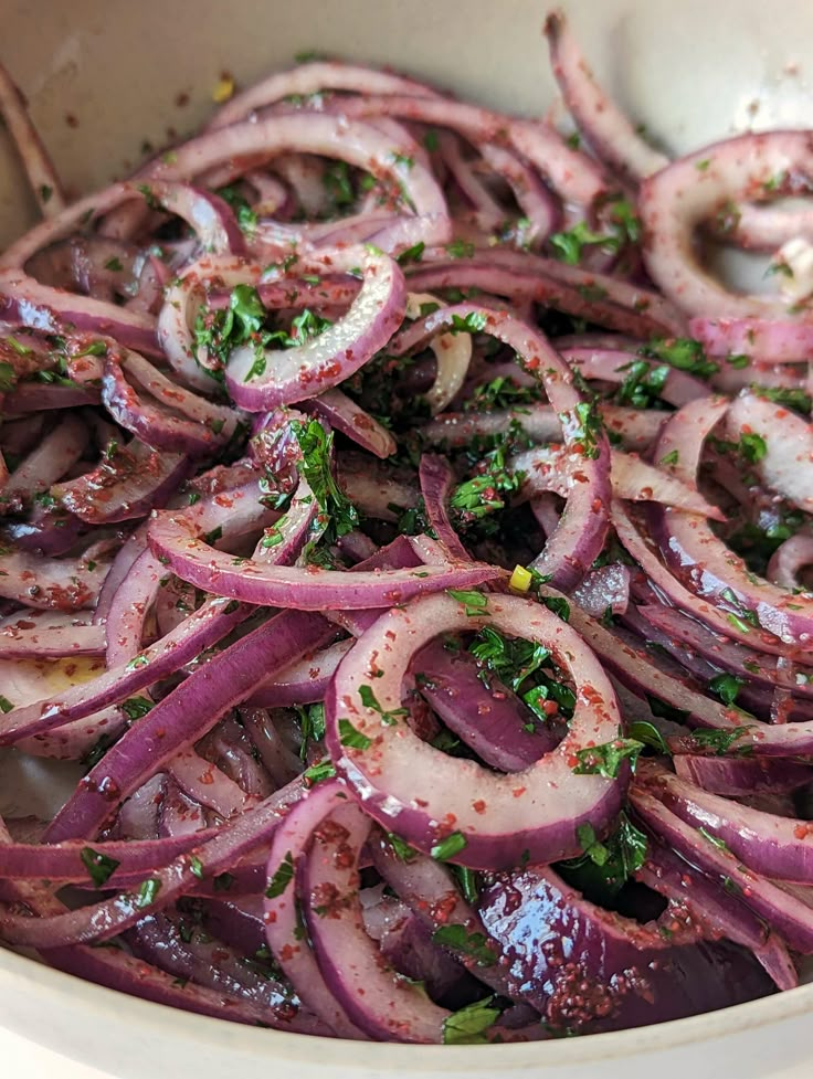 an onion dish with onions and herbs in it