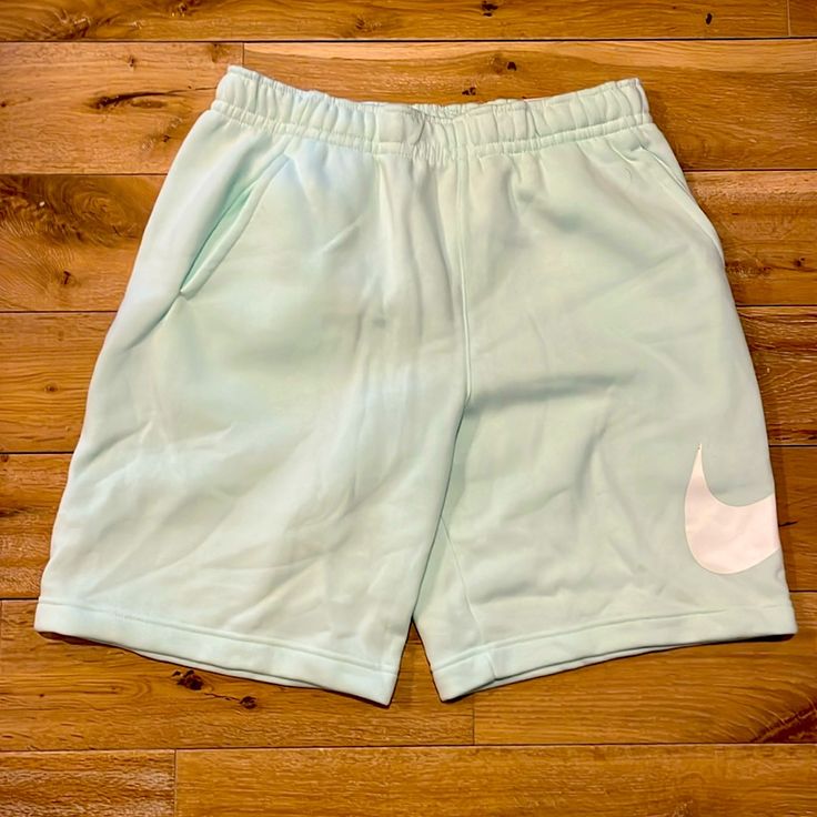 Nike Shorts, Snap Back Pocket, Side Pockets, Drawstring. The Nike Sportswear Club Shorts Blend Classic Comfort With A Bold Graphic For Street-Ready Style. Crafted From Soft Fleece, They've Got You Covered For All-Day Wear. Bermuda Bottoms For Spring Leisure, Leisure Bermuda Bottoms For Spring, Spring Bermuda Leisure Bottoms, Comfortable Nike Bottoms With Built-in Shorts, Spring Loungewear Sportswear Shorts, Nike Comfortable Shorts, Nike Athletic Shorts With Elastic Waistband For Leisure, Nike Comfortable Athletic Shorts, Nike Casual Workout Shorts