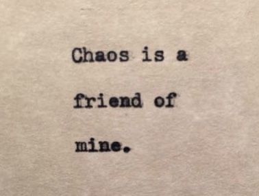 an old typewriter with the words chaos is a friend of mine