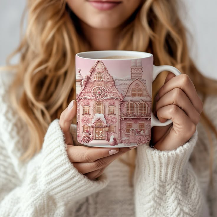 a woman holding a pink coffee mug in her hands