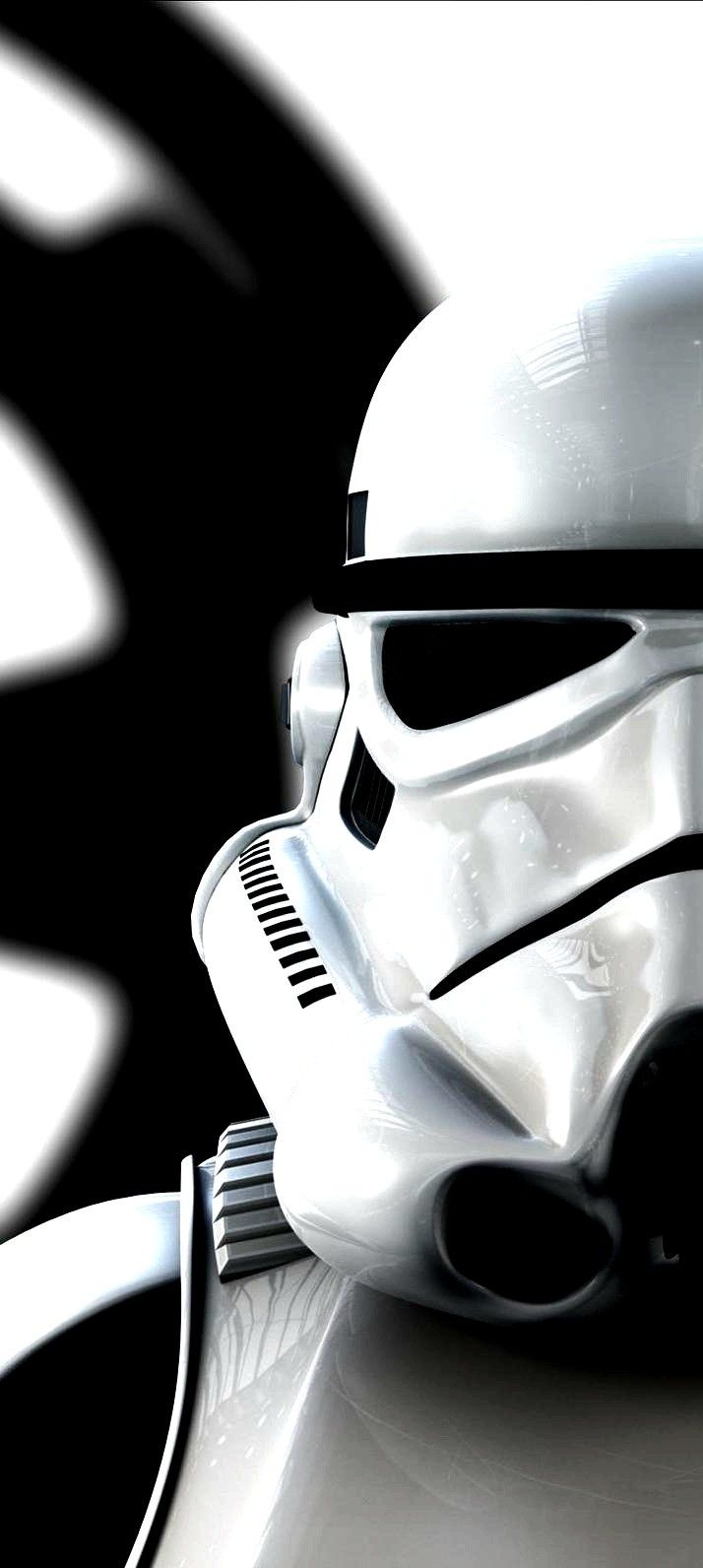 a star wars helmet is sitting on top of a white table with a black and white background