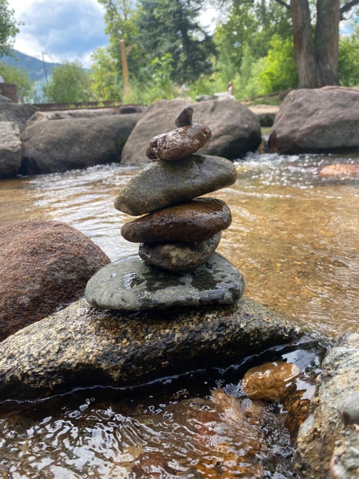 rocks stacked on top of each other in the water