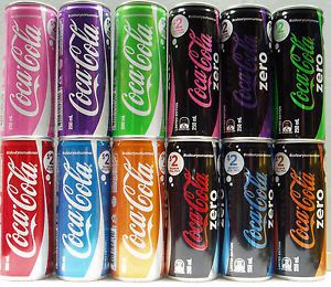 six cans of coca - cola are lined up on a white surface, each with different colors