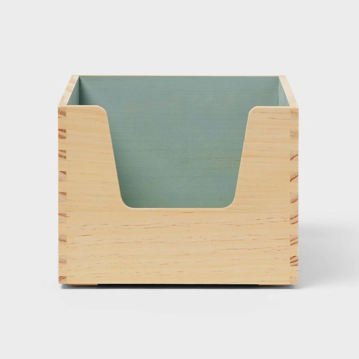 a wooden box with a green lid on it's front and side sides, in the shape of a rectangle