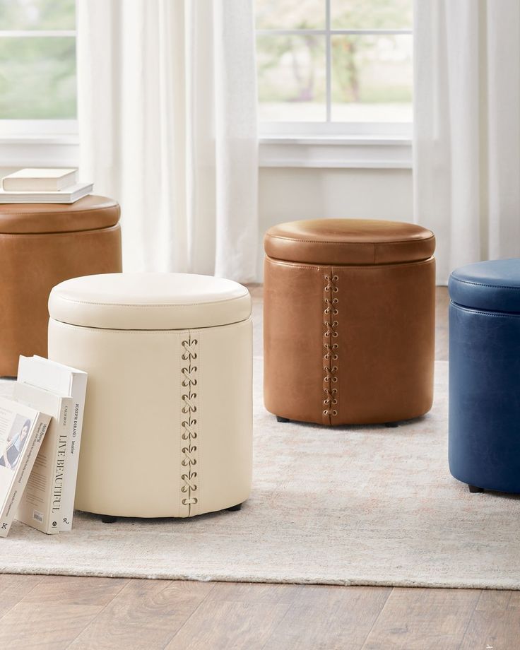 three stools sitting on top of a rug in front of a window