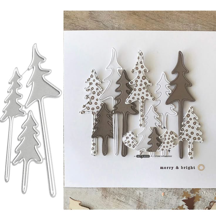 christmas trees and snowflakes are on the table next to some crafting supplies