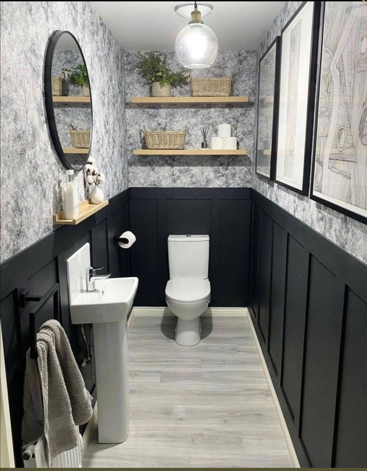 the bathroom is decorated in black and white