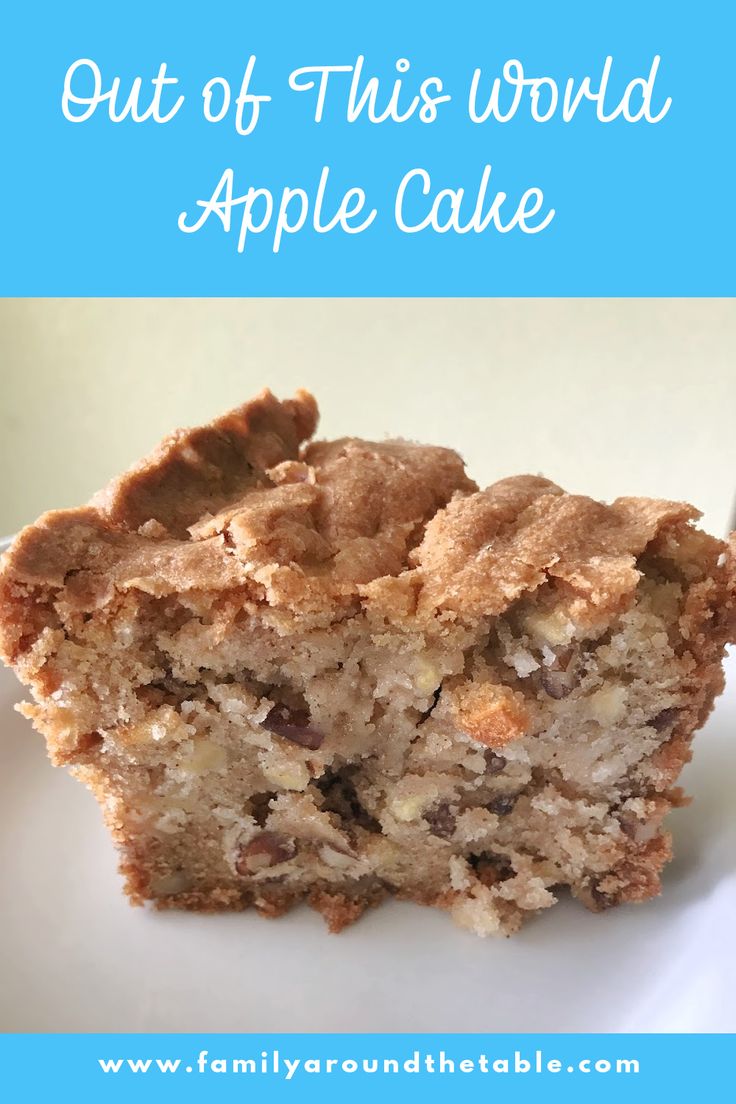 a close up of a piece of cake on a plate with the words out of this world apple cake