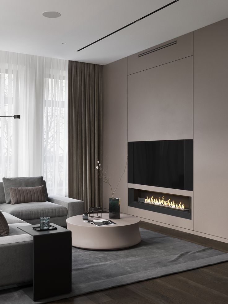 a modern living room with a fireplace in the center