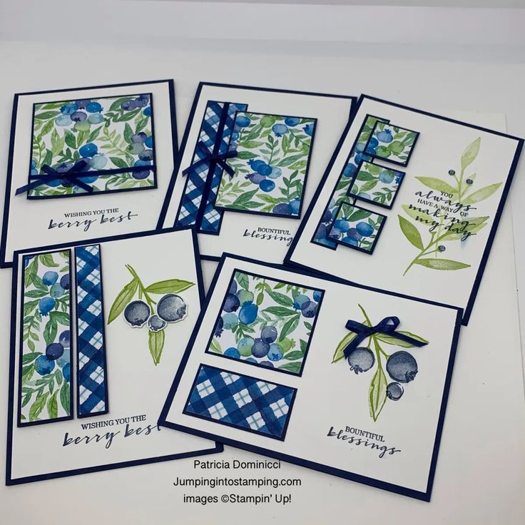 four cards with blue flowers and green leaves