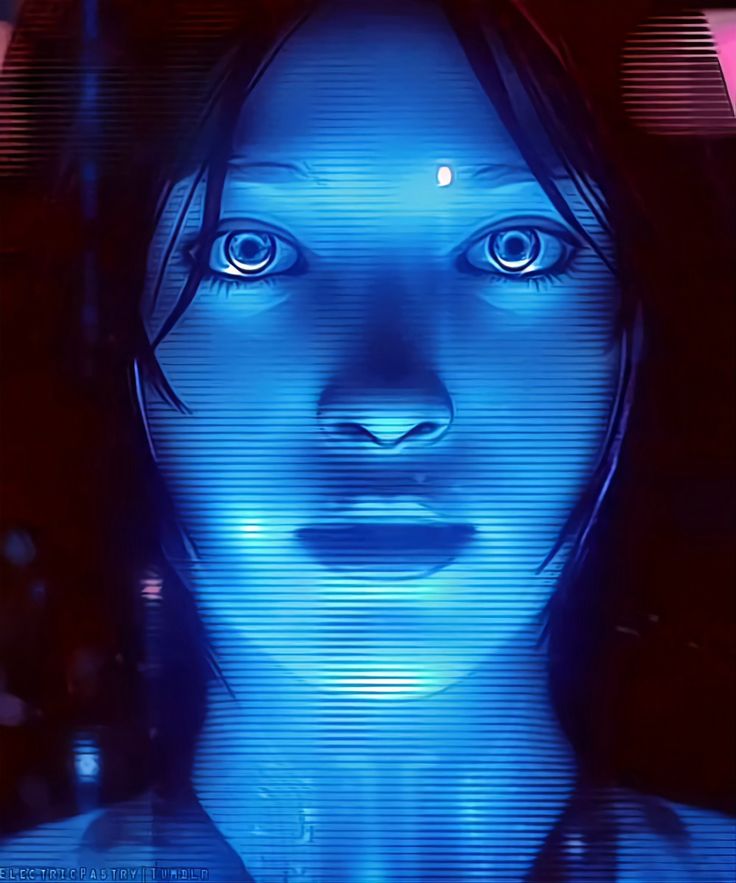 a woman's face is glowing blue in the dark