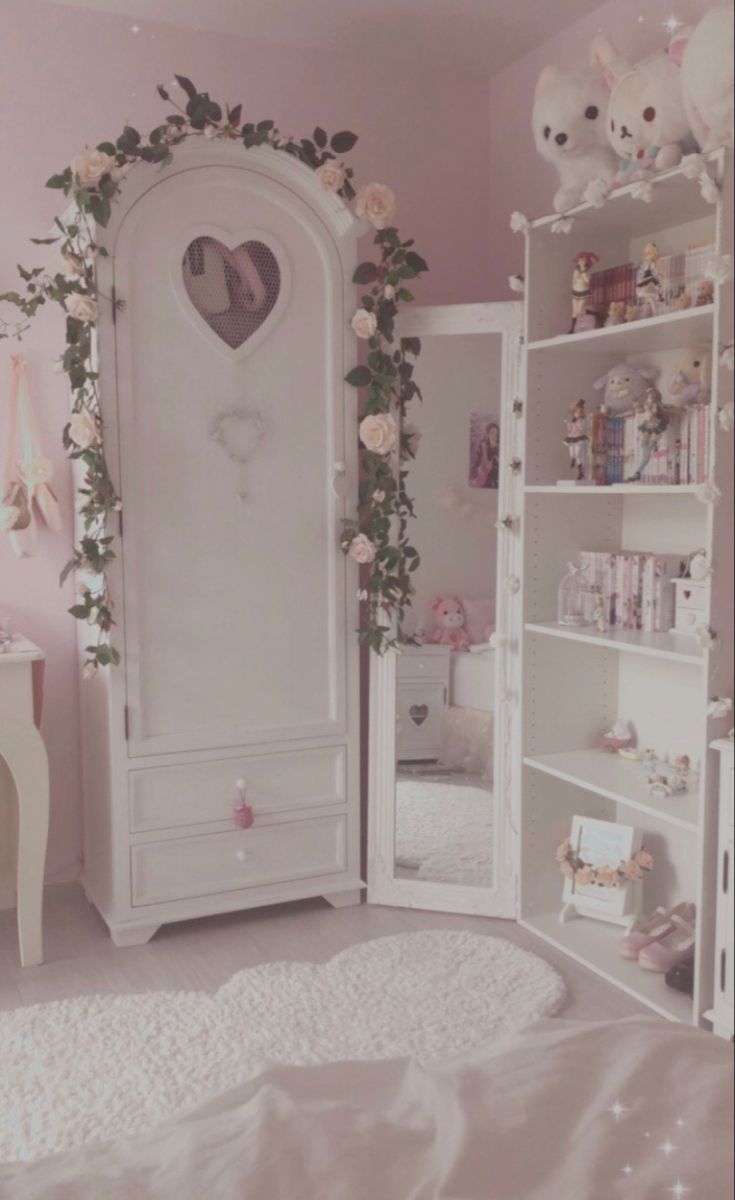 a bedroom with pink walls and white furniture in the corner is decorated with flowers, teddy bears and stuffed animals