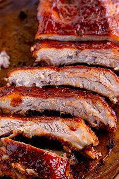 slices of bbq ribs on a cutting board