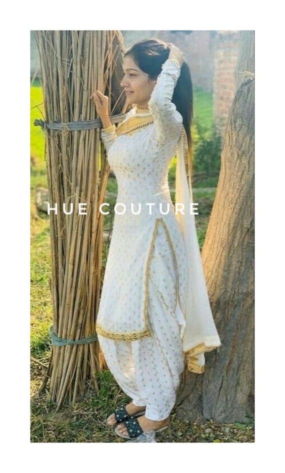 Designer Beautiful 3 piece Salwar Kameez with dupatta , Indian Designer Festivals / Partywear Kurta with Pant set / punjabi dress by Hue Couture Color- As same as in picture , also please check our color chart all colors can be possible. Fabric- Silk, Georgette, Brocade silk, Chiffone, Laces, Size: This is custom made as per your size. Any size possible be it for kids or plus sizes. Handling time: Don't worry, just tell me, I will process it accordingly and deliver on or before a delivery date you mention. Thanks for visit our shop. Best regards- Team- HueCouture Patiyala Shalwar, Suit Punjabi Patiala, White Salwar Suit, White Salwar, Patiala Dress, Temple Wallpaper, White Salwar Kameez, Patiala Suit Designs, Patiyala Suit