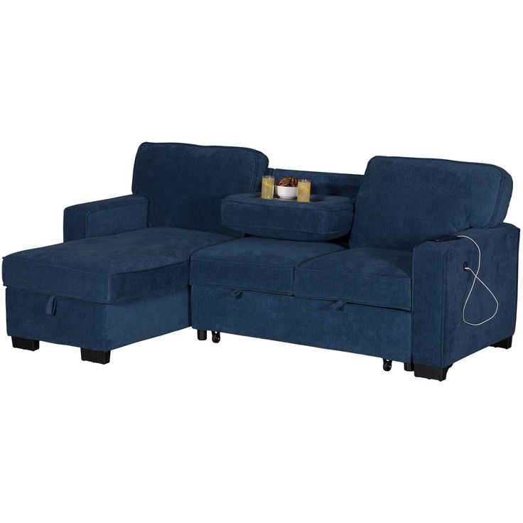 a blue sectional couch with storage underneath it