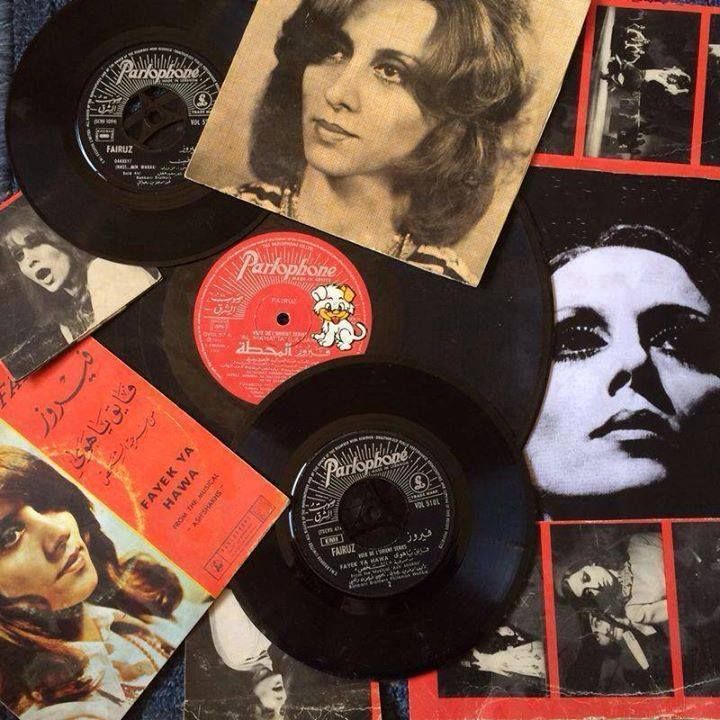 some old records are laying on top of each other, with pictures of women in them