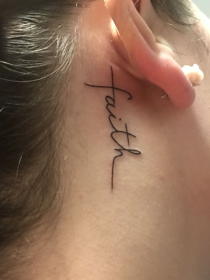 a woman's behind the ear tattoo with chinese characters on her left side ribcage