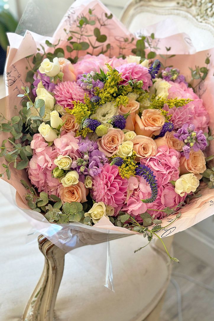 a bouquet of flowers sitting on top of a table