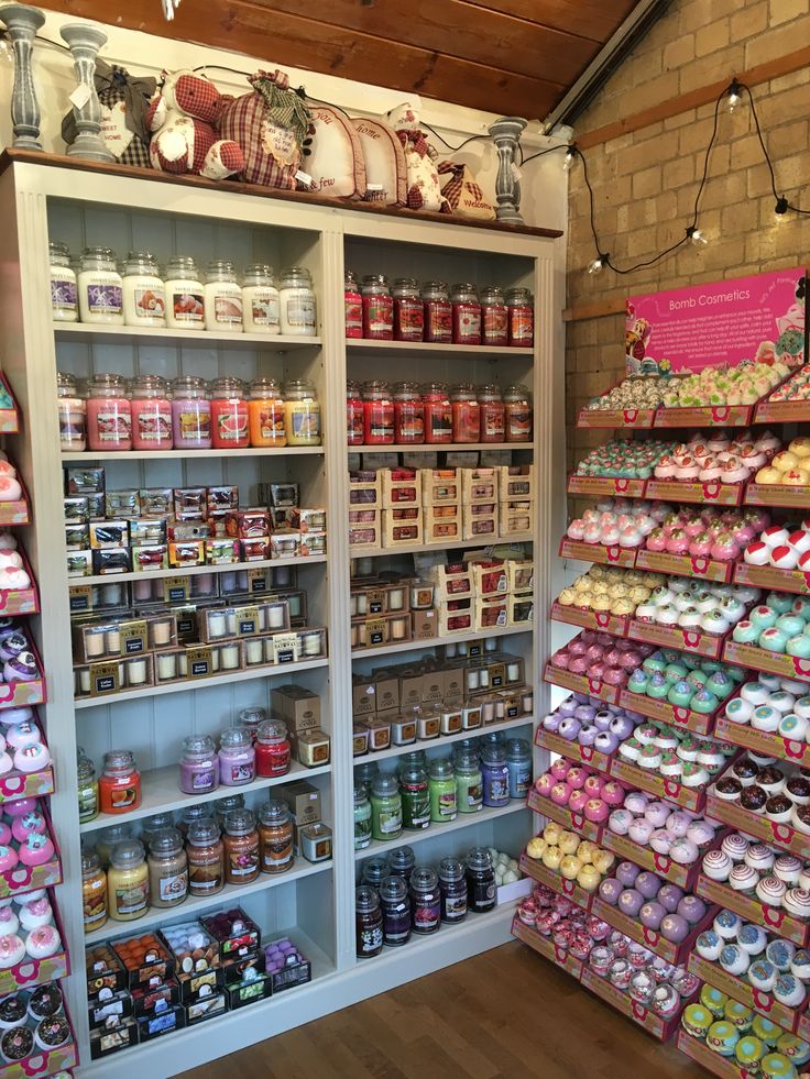 the shelves are filled with many different types of food and condiments in jars