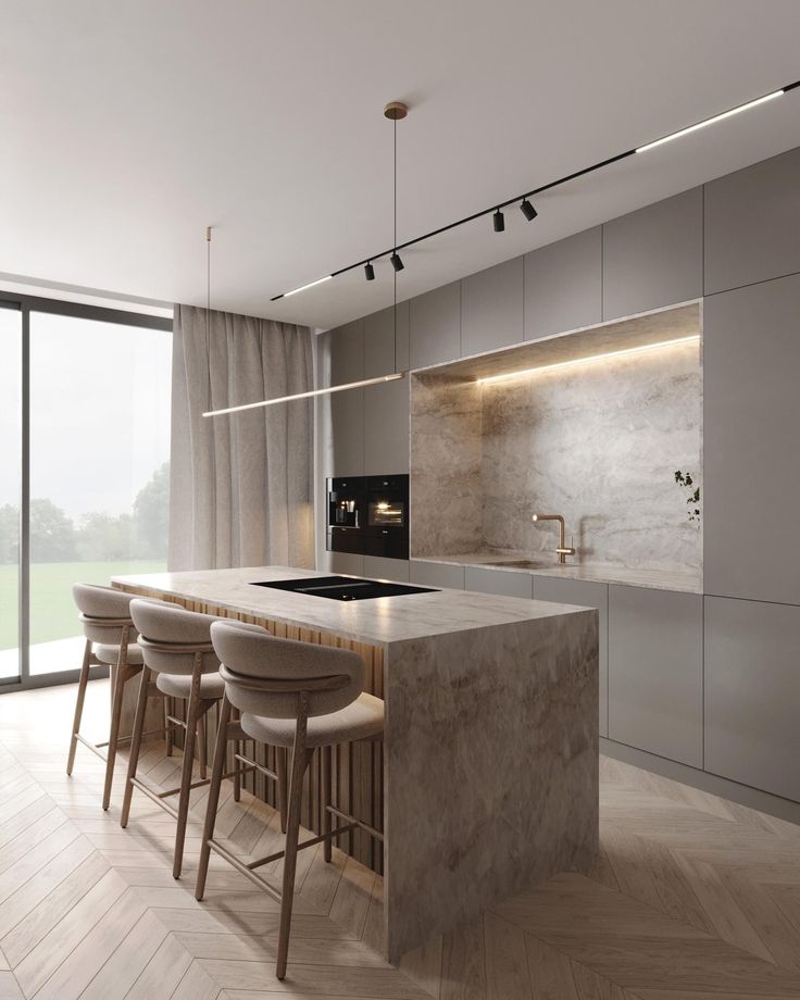 a modern kitchen with marble counter tops and bar stools