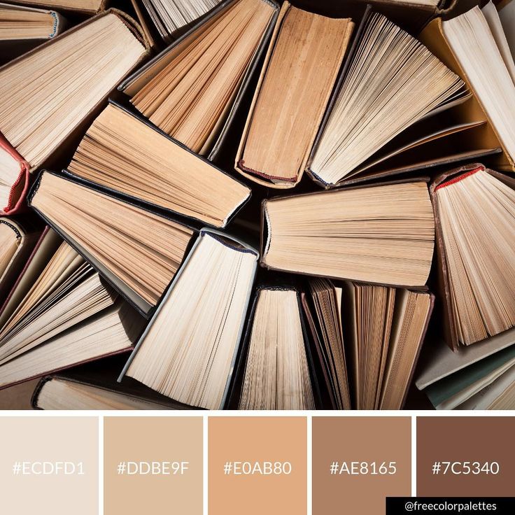 a bunch of books that are sitting in the middle of some color swatches,