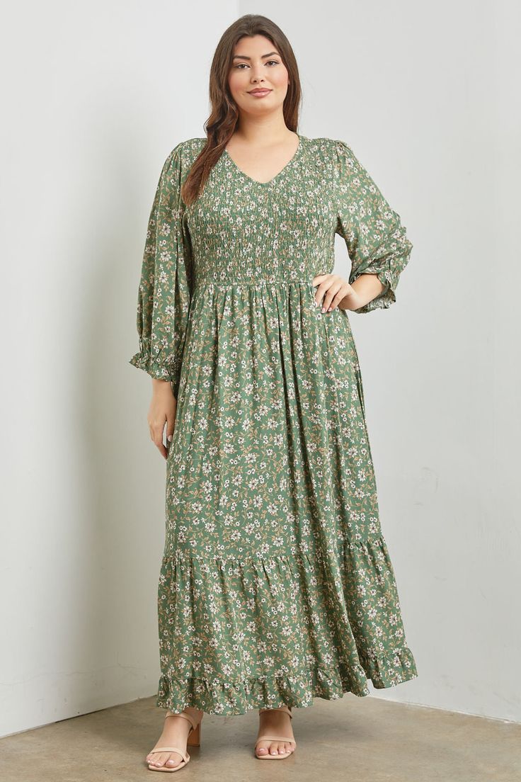 Effortless style meets comfort with this print maxi dress. The smocked top flatters your figure while the stretchy waist ensures a comfortable fit for all body types. Made from soft and flowy rayon, this dress drapes beautifully and features long sleeves for cooler days. A single tier at the bottom adds a touch of movement and elegance, while handy pockets provide functionality. The body of the dress is lined. About the fabric: Rayon is a soft, breathable fabric that is derived from wood pulp. It's comfortable to wear in warm weather and drapes nicely, making it perfect for this flowing maxi dress. Body is 100% Rayon, lining is Polyester Hand wash cold, hang to dry Approximate size chart:Bust measurement taken from 1 inch below the arm holeBust/Waist in inches1X: 38-48 / 36-462X: 40-50 / 3 Long Floral Dress Plus Size, Dress Rayon Hijab, Maxi Dress Outfits, Dresses Long Elegant, Smocked Maxi Dress, Beautiful Long Dresses, Midi Dress Plus Size, Maxi Dress Outfit, Dress Drape