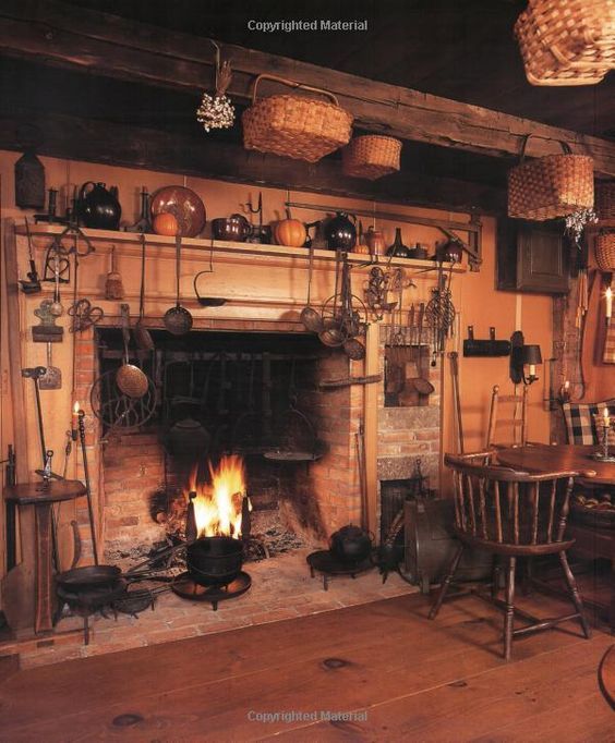 an old fashioned fireplace with pots and pans on it