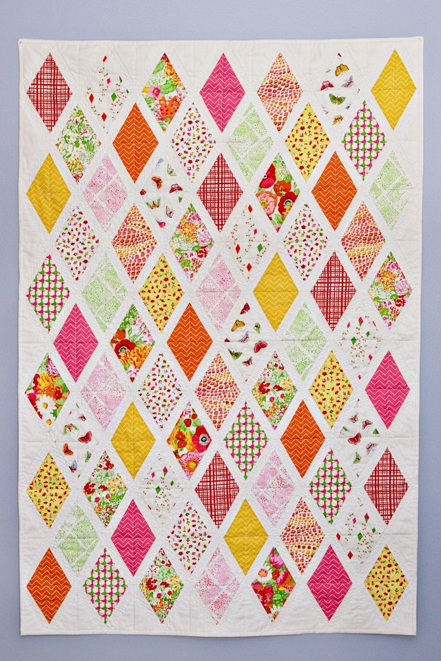 a colorful quilt with many squares on it