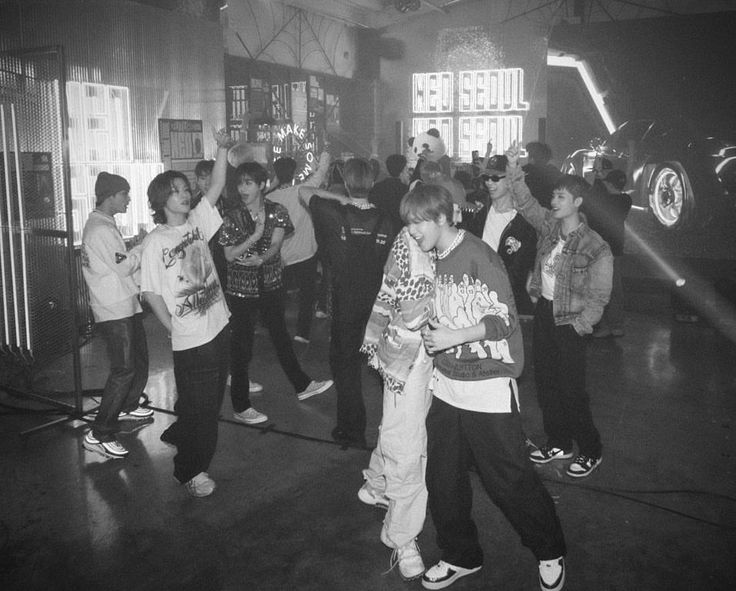 black and white photograph of people dancing in a room