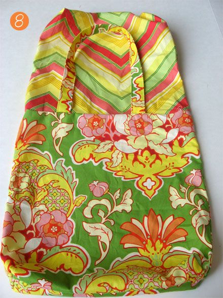 a green and yellow bag with flowers on it