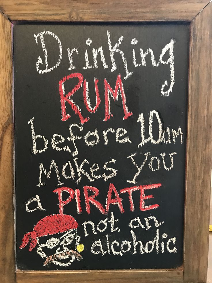 a chalk board with writing on it that says drinking rum before 10am makes you a pirate not an alcoholic