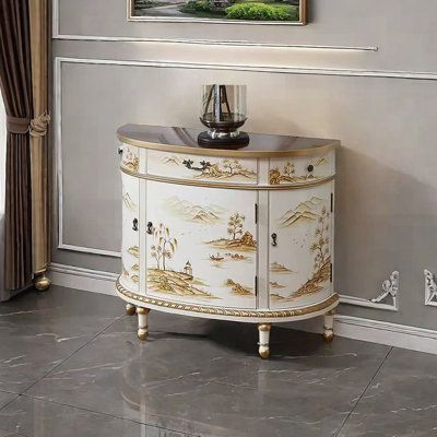 a white and gold painted cabinet in the corner of a room with a painting on the wall