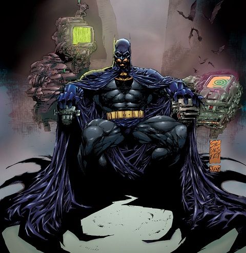 batman sitting in the dark with his hands on his knees