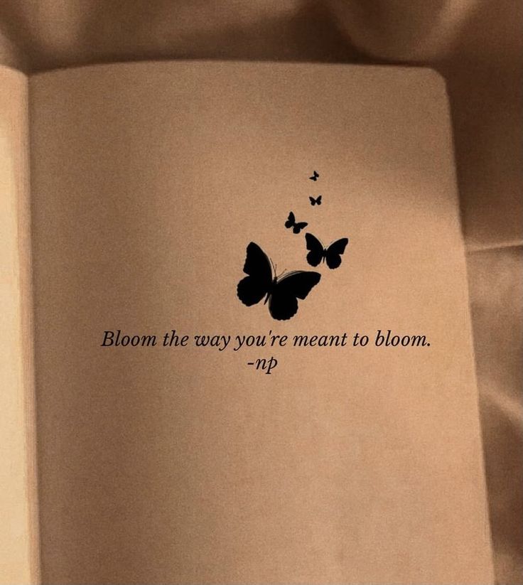 an open book with butterflies on it and the words bloom the way you're meant to bloom