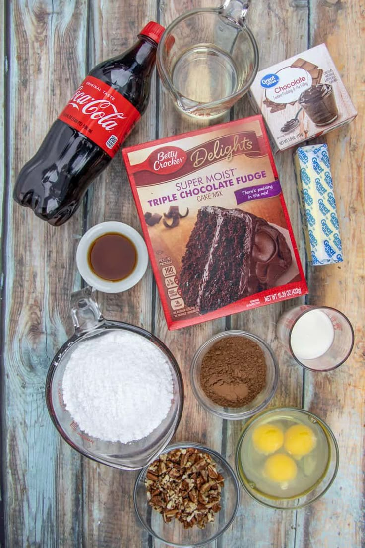 ingredients for chocolate cake laid out on a wooden table