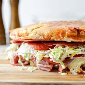 a close up of a sandwich on a cutting board