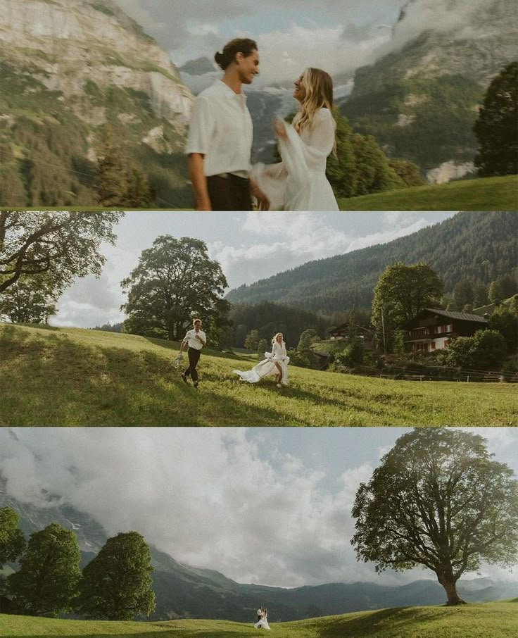 two people are walking in the grass with mountains behind them